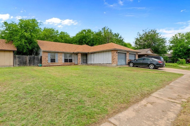 10706 Topperwein Dr, Austin, TX 78758 - ranch-style house featuring an attached garage, brick siding, and driveway
