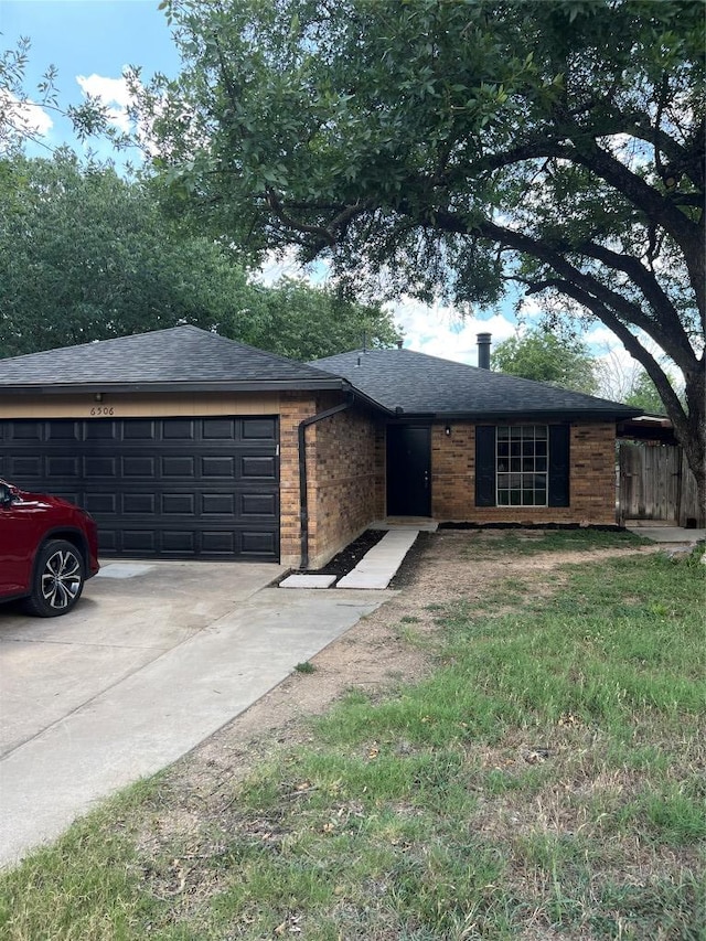 6506 Clubway Ln, Austin, TX 78745 - ranch-style home with an attached garage, driveway, a shingled roof, and brick siding