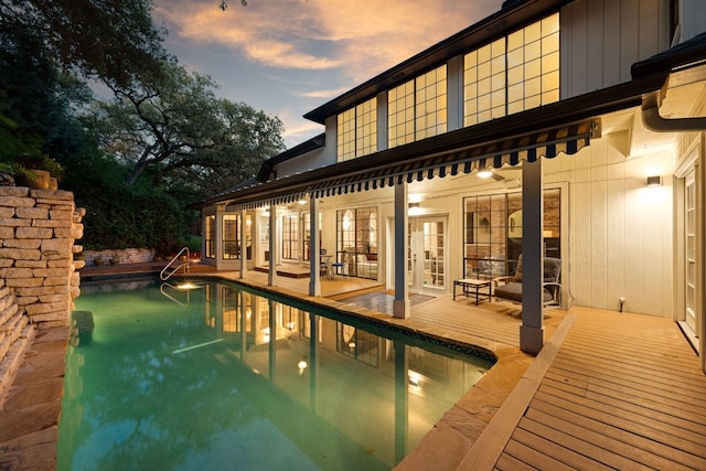 5301 Backtrail Dr, Austin, TX 78731 - rear view of property with french doors, an outdoor pool, and a patio