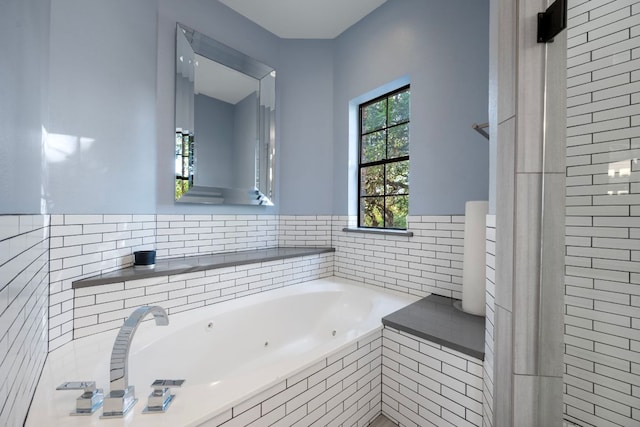 5301 Backtrail Dr, Austin, TX 78731 - full bathroom featuring a jetted tub and tile walls