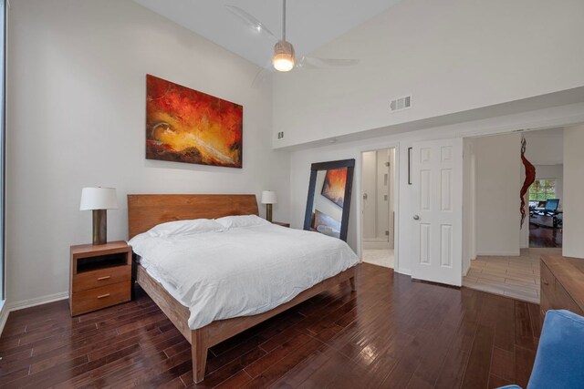 5301 Backtrail Dr, Austin, TX 78731 - bedroom with wood finished floors, a ceiling fan, a towering ceiling, and ensuite bathroom