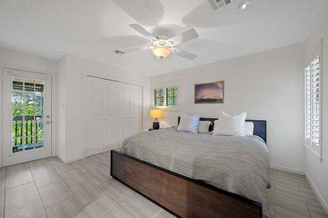 5301 Backtrail Dr, Austin, TX 78731 - bedroom with multiple windows, ceiling fan, a closet, and access to exterior