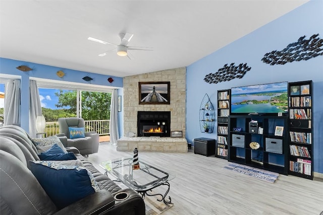 200 Full Moon Unit 4, Horseshoe Bay, TX 78657 - living area featuring ceiling fan, lofted ceiling, wood finished floors, and a fireplace