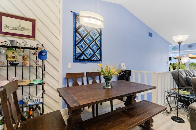 200 Full Moon Unit 4, Horseshoe Bay, TX 78657 - dining space featuring vaulted ceiling and wood finished floors