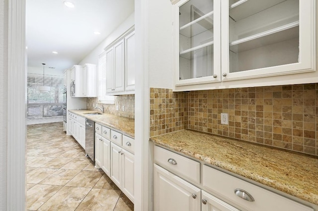 3340 Marcasite Dr, Round Rock, TX 78681 - kitchen featuring stainless steel dishwasher, light stone countertops, decorative backsplash, white cabinets, and recessed lighting