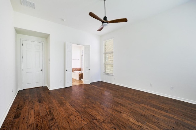 3340 Marcasite Dr, Round Rock, TX 78681 - unfurnished bedroom featuring dark wood finished floors, connected bathroom, and a ceiling fan