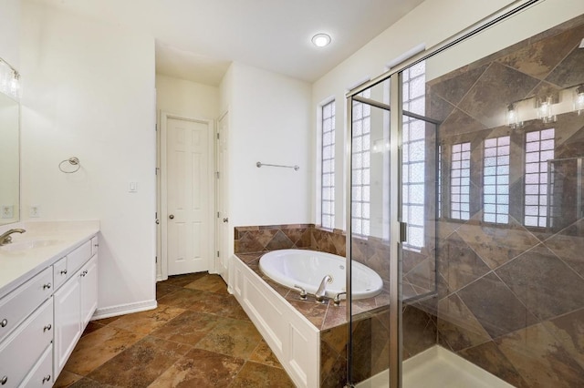 3340 Marcasite Dr, Round Rock, TX 78681 - bathroom featuring vanity, a bath, a stall shower, and stone finish floors