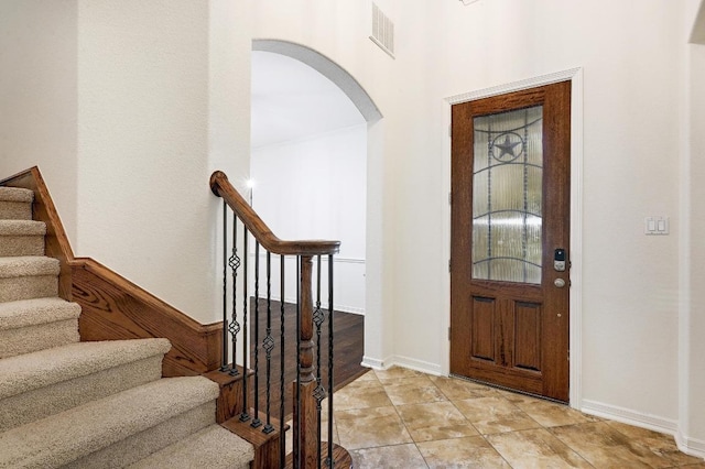 3340 Marcasite Dr, Round Rock, TX 78681 - foyer entrance featuring arched walkways and stairway