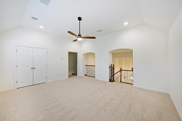 3340 Marcasite Dr, Round Rock, TX 78681 - unfurnished living room featuring ceiling fan, arched walkways, light carpet, recessed lighting, and high vaulted ceiling