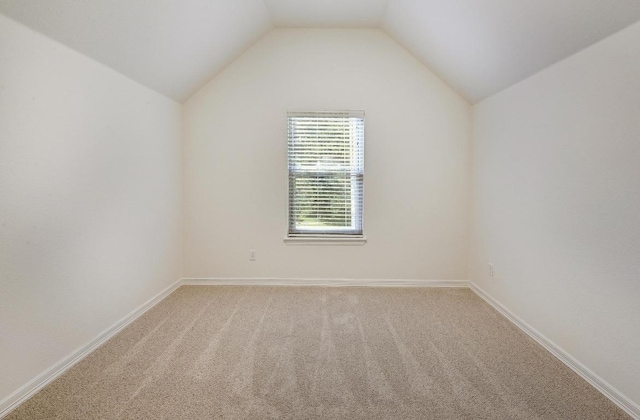 3340 Marcasite Dr, Round Rock, TX 78681 - empty room featuring vaulted ceiling and light carpet