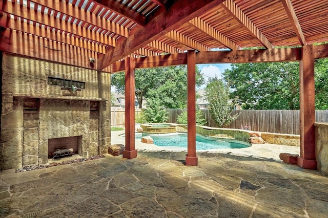 3340 Marcasite Dr, Round Rock, TX 78681 - fenced backyard with an outdoor stone fireplace, a patio, and a pool with connected hot tub