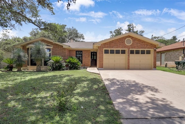 1928 Ramona Cir, San Marcos, TX 78666 - ranch-style house featuring an attached garage, driveway, a front yard, and brick siding