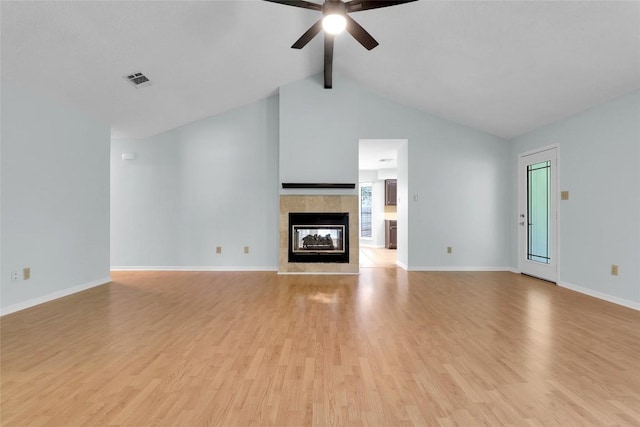 1928 Ramona Cir, San Marcos, TX 78666 - unfurnished living room featuring light wood-type flooring, ceiling fan, and a fireplace
