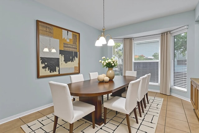 1928 Ramona Cir, San Marcos, TX 78666 - dining space featuring light tile patterned floors, plenty of natural light, and a chandelier