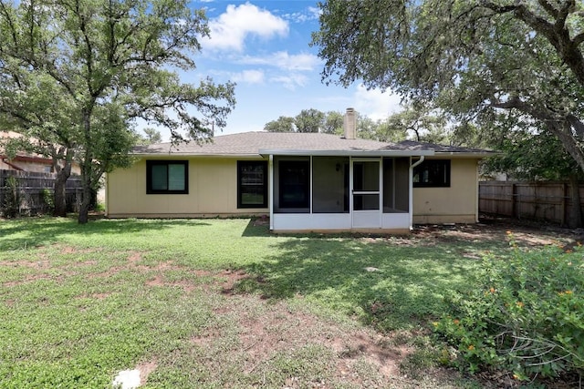 1928 Ramona Cir, San Marcos, TX 78666 - back of property featuring a chimney and a sunroom