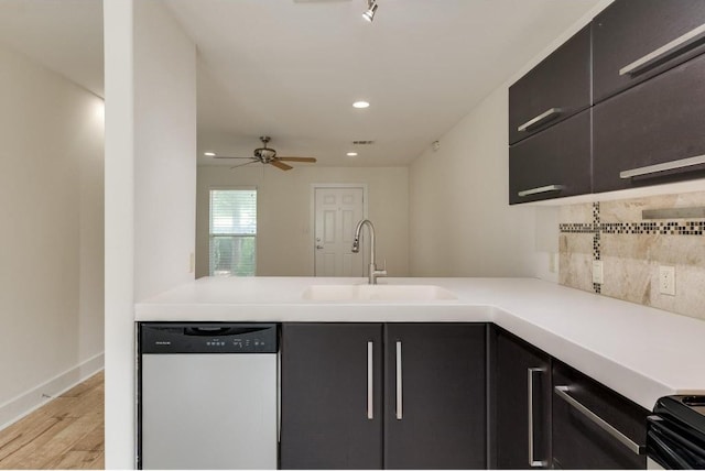1101 Grove Blvd Unit 102, Austin, TX 78741 - kitchen featuring dishwasher, tasteful backsplash, light wood-style flooring, recessed lighting, and light countertops