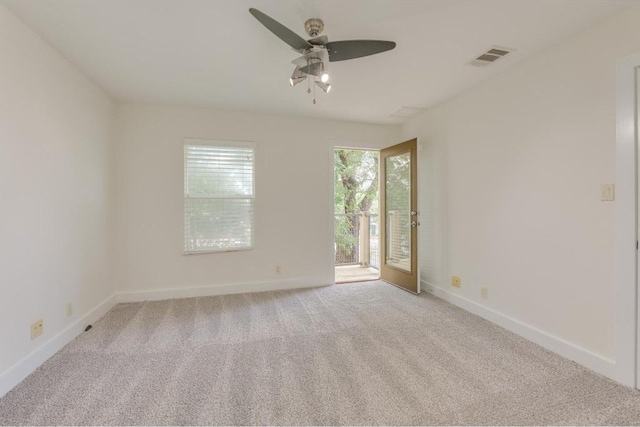 1101 Grove Blvd Unit 102, Austin, TX 78741 - spare room with a ceiling fan and carpet floors