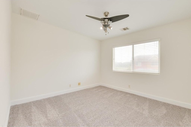 1101 Grove Blvd Unit 102, Austin, TX 78741 - carpeted spare room with baseboards and a ceiling fan