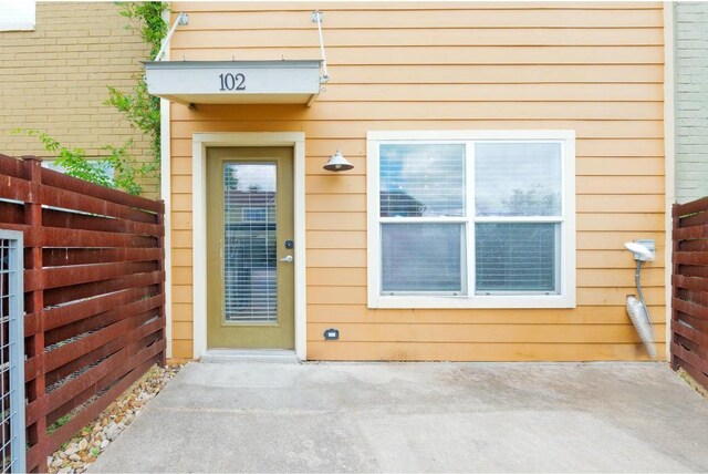 1101 Grove Blvd Unit 102, Austin, TX 78741 - view of exterior entry featuring a patio
