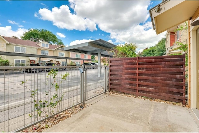 1101 Grove Blvd Unit 102, Austin, TX 78741 - view of patio / terrace featuring a residential view and a gate