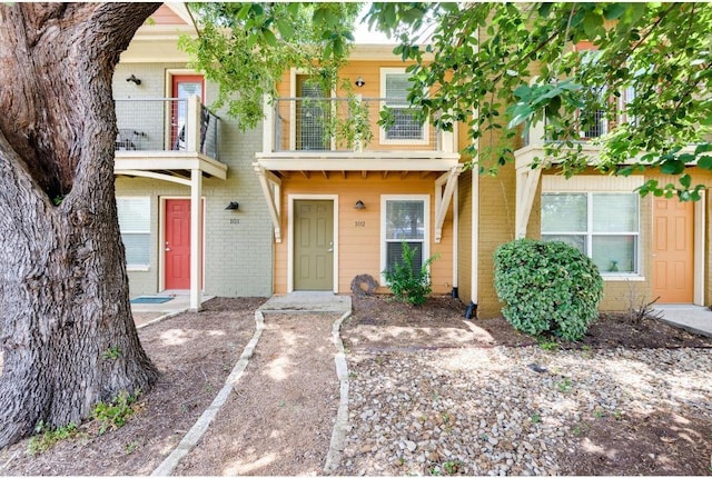 1101 Grove Blvd Unit 102, Austin, TX 78741 - multi unit property featuring a balcony and brick siding