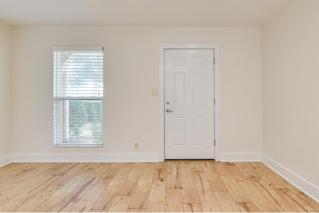 1101 Grove Blvd Unit 102, Austin, TX 78741 - empty room featuring wood-type flooring and baseboards