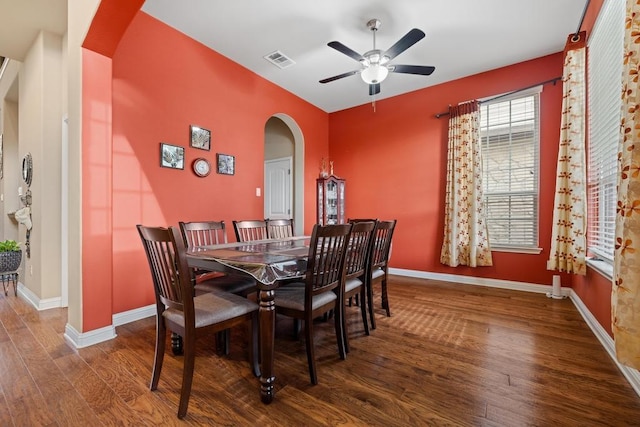 614 Spanish Mustang Dr, Cedar Park, TX 78613 - dining room featuring arched walkways, a ceiling fan, and wood finished floors