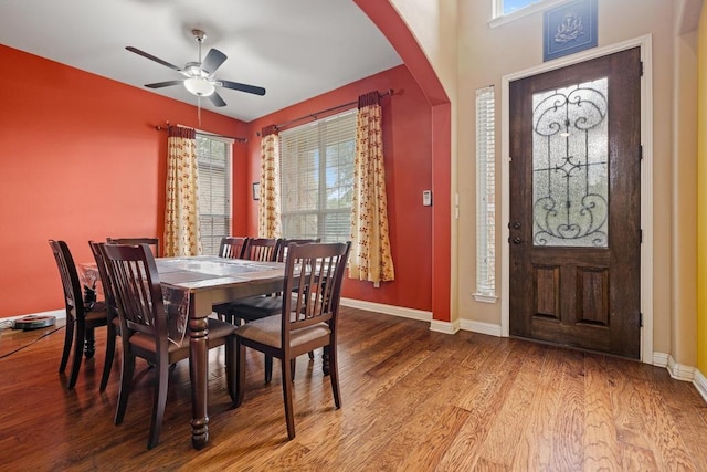 614 Spanish Mustang Dr, Cedar Park, TX 78613 - dining room with a ceiling fan, wood finished floors, and arched walkways