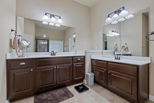 614 Spanish Mustang Dr, Cedar Park, TX 78613 - full bathroom featuring a stall shower, two vanities, and tile patterned floors