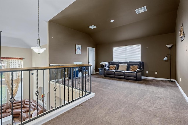 614 Spanish Mustang Dr, Cedar Park, TX 78613 - carpeted living area featuring vaulted ceiling and baseboards