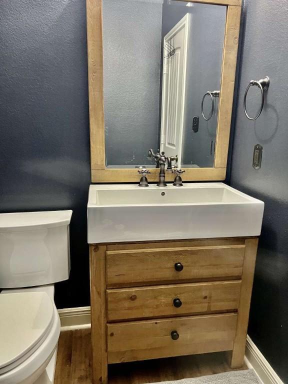 2118 Howell Mountain Dr, Cedar Park, TX 78613 - half bath with vanity and wood finished floors
