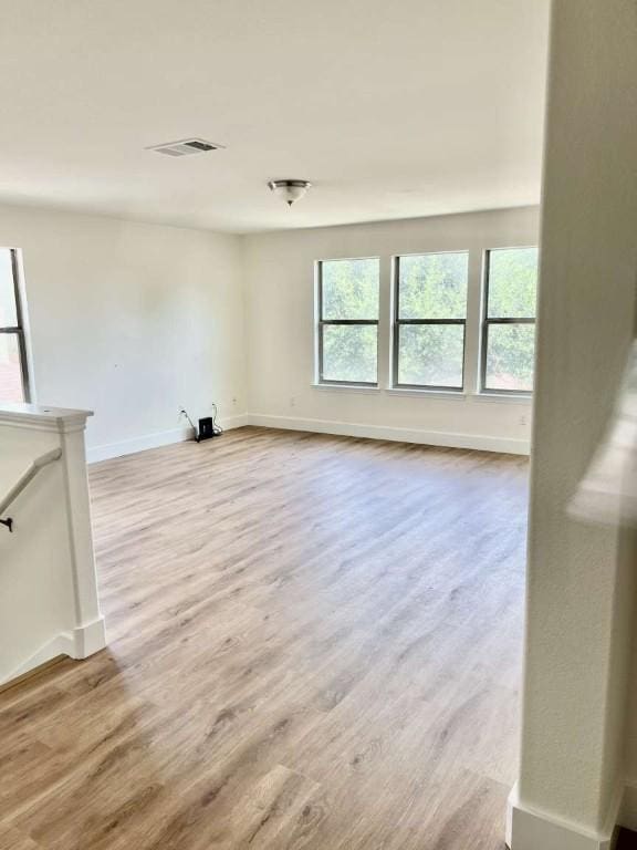 2118 Howell Mountain Dr, Cedar Park, TX 78613 - unfurnished living room featuring wood finished floors and baseboards
