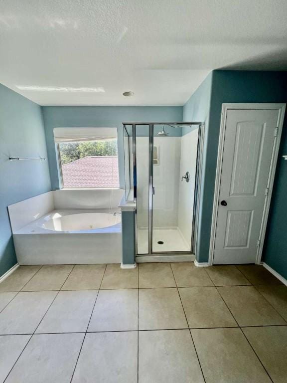 2118 Howell Mountain Dr, Cedar Park, TX 78613 - full bathroom with a bath, a shower stall, tile patterned floors, and a textured ceiling
