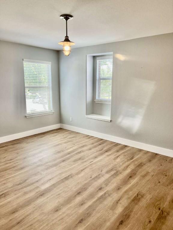 2118 Howell Mountain Dr, Cedar Park, TX 78613 - empty room featuring healthy amount of natural light and wood finished floors