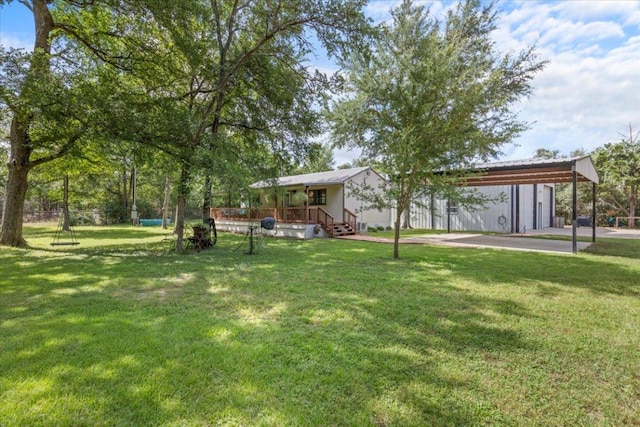 1307 Fm 969, Bastrop, TX 78602 - view of green lawn with a carport and a wooden deck