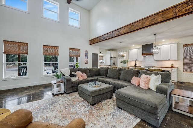20008 Victoria Chase Rd, Lago Vista, TX 78645 - living area with a chandelier and a high ceiling