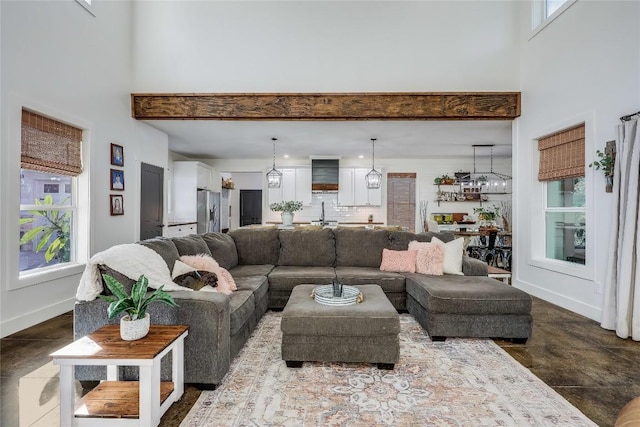 20008 Victoria Chase Rd, Lago Vista, TX 78645 - living room featuring a high ceiling and baseboards