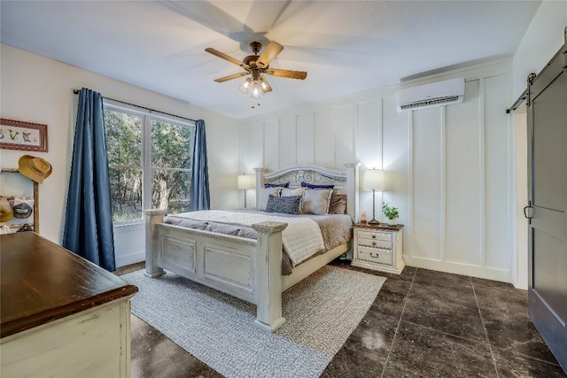 20008 Victoria Chase Rd, Lago Vista, TX 78645 - bedroom featuring a wall mounted AC, a decorative wall, a barn door, and ceiling fan