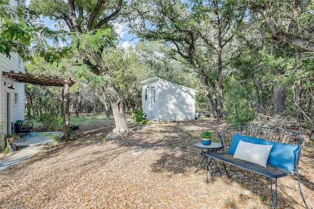 20008 Victoria Chase Rd, Lago Vista, TX 78645 - view of yard featuring a shed, a patio, and view of wooded area