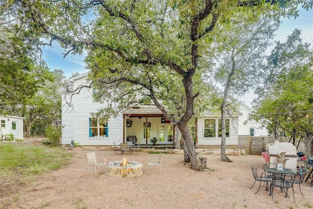 20008 Victoria Chase Rd, Lago Vista, TX 78645 - rear view of house with a fire pit, french doors, and a patio area