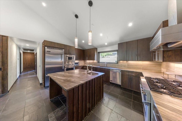 2817 Tradewind Dr, Spicewood, TX 78669 - kitchen with built in appliances, wall chimney range hood, decorative backsplash, a center island with sink, and recessed lighting