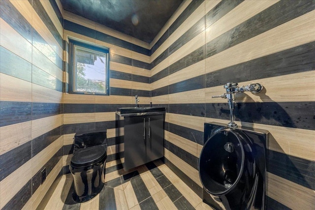 2817 Tradewind Dr, Spicewood, TX 78669 - half bathroom with a sink and wooden walls