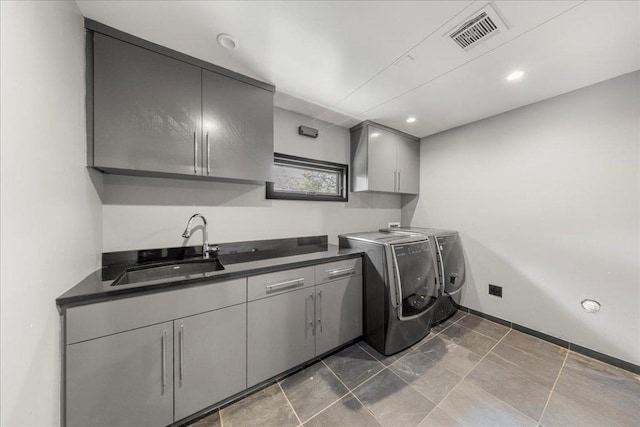 2817 Tradewind Dr, Spicewood, TX 78669 - laundry room with cabinet space, washer and clothes dryer, and recessed lighting