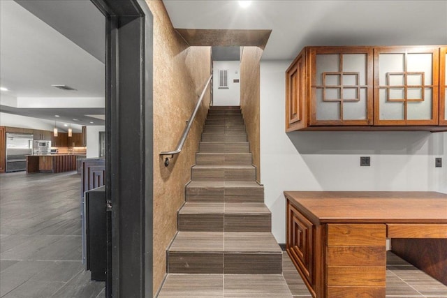 2817 Tradewind Dr, Spicewood, TX 78669 - staircase with recessed lighting