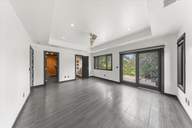2817 Tradewind Dr, Spicewood, TX 78669 - unfurnished room featuring a tray ceiling and recessed lighting