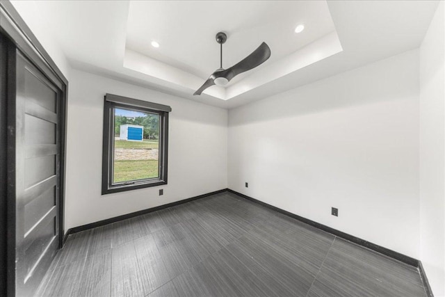 2817 Tradewind Dr, Spicewood, TX 78669 - unfurnished bedroom with a raised ceiling, ceiling fan, and recessed lighting