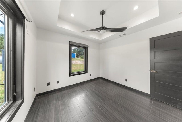 2817 Tradewind Dr, Spicewood, TX 78669 - spare room with plenty of natural light, a raised ceiling, a ceiling fan, and recessed lighting