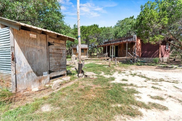 1800 N Rainbow Ranch Rd, Wimberley, TX 78676 - view of yard featuring a storage unit