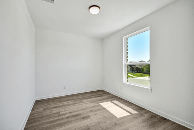 564 Biscayne Bay Bnd, Kyle, TX 78640 - empty room featuring wood finished floors and baseboards