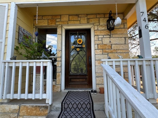 746 Pecan Ln, Cottonwood Shores, TX 78657 - doorway to property with stone siding and covered porch